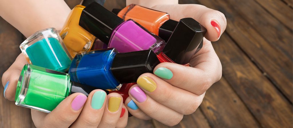 woman holding colorful bottles of nail polish - CHEMWISE Nail Polish Reverse Distribution